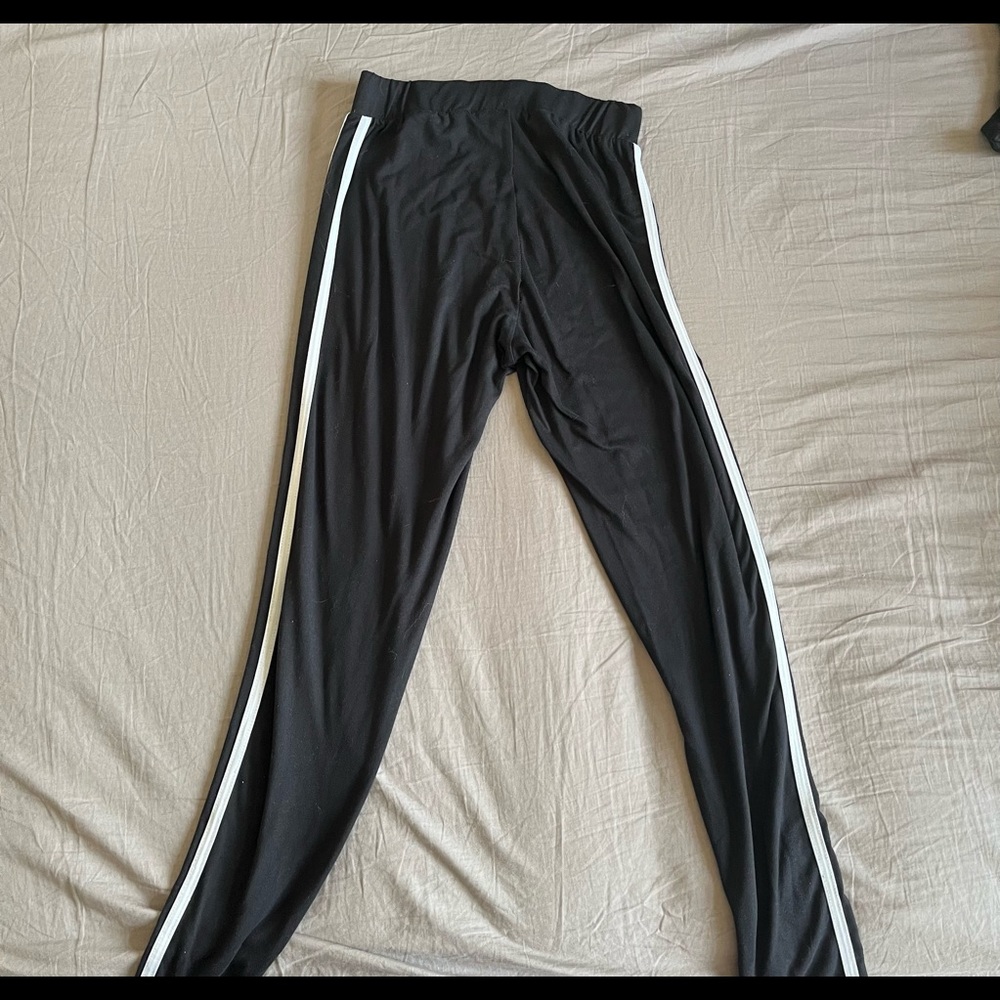 Black leggings with two white strips down the side